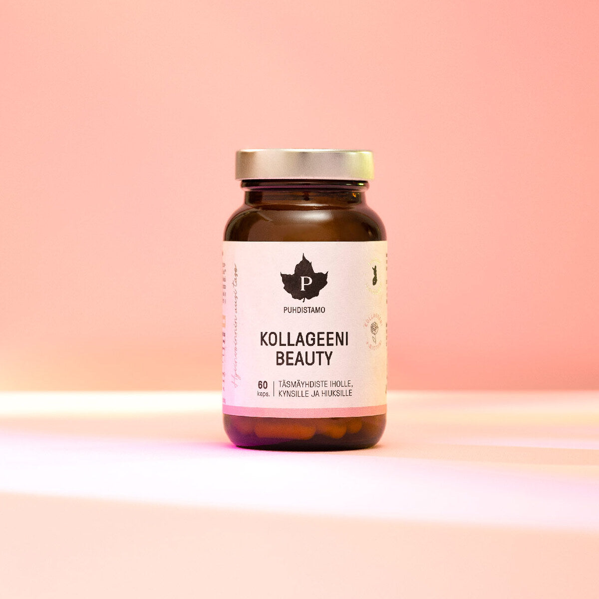 Collagen Beauty supplement bottle on a pastel background.