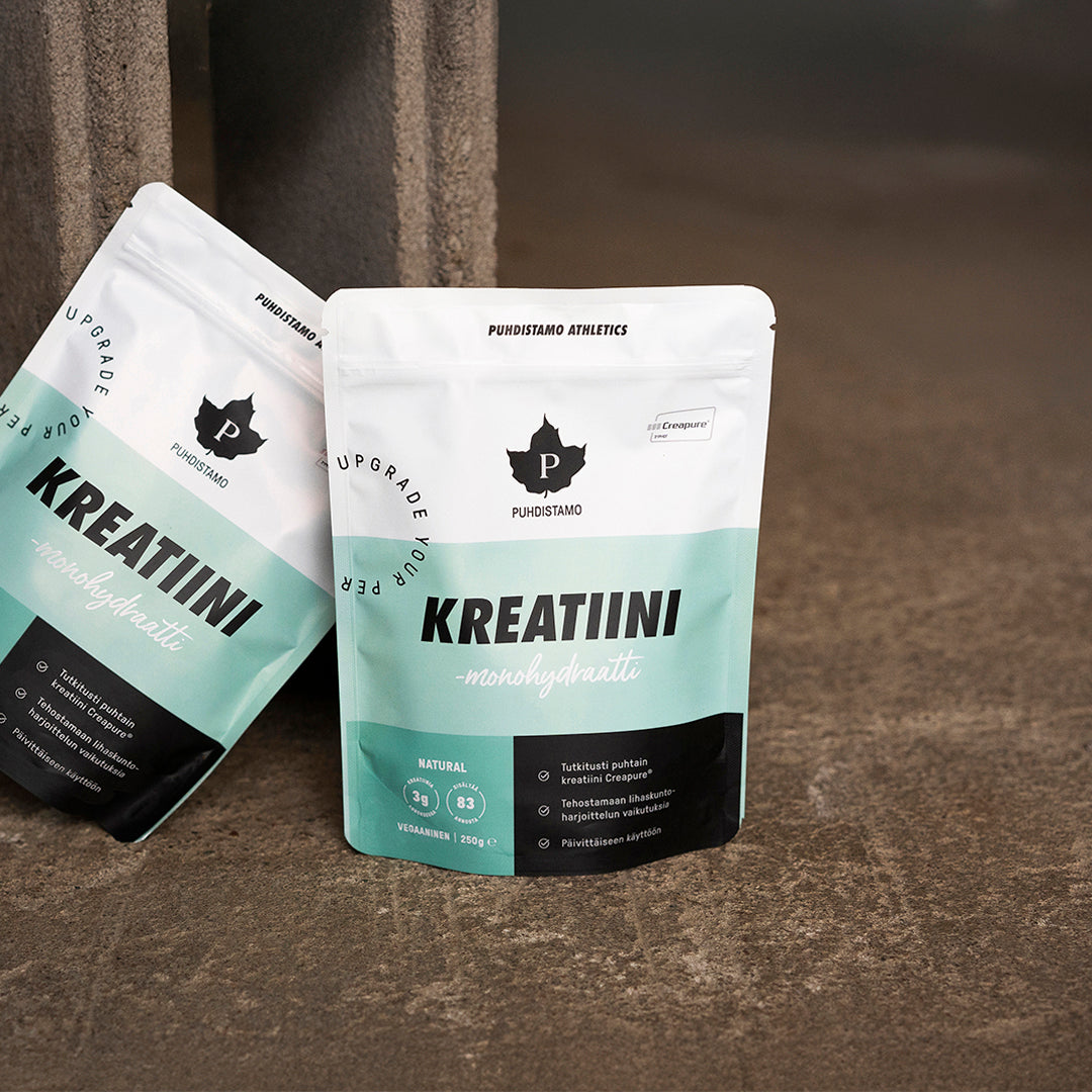 Two bags of Kreatiini dietary supplement on a surface.