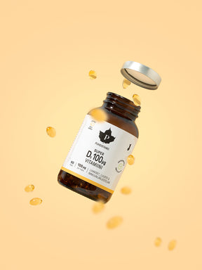 Puhdistamon Super D-vitamiini 60 kapselinen purkki ja kapseleita lentää ilmassa