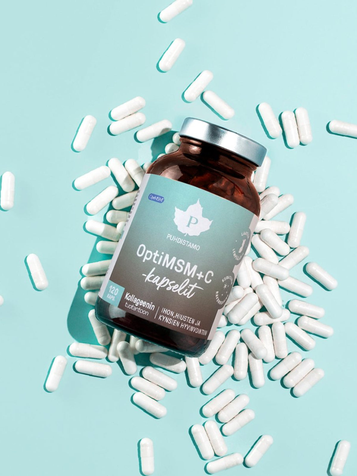 OptiMSM + C purkki ja kapseleita vaaleansinisellä taustalla