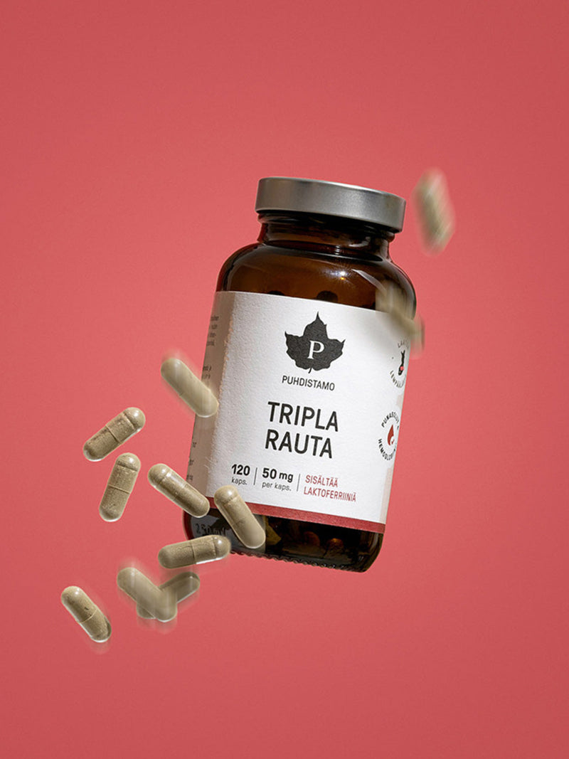 Puhdistamon Tripla Rauta purkki ja kapseleita punaista taustaa vasten