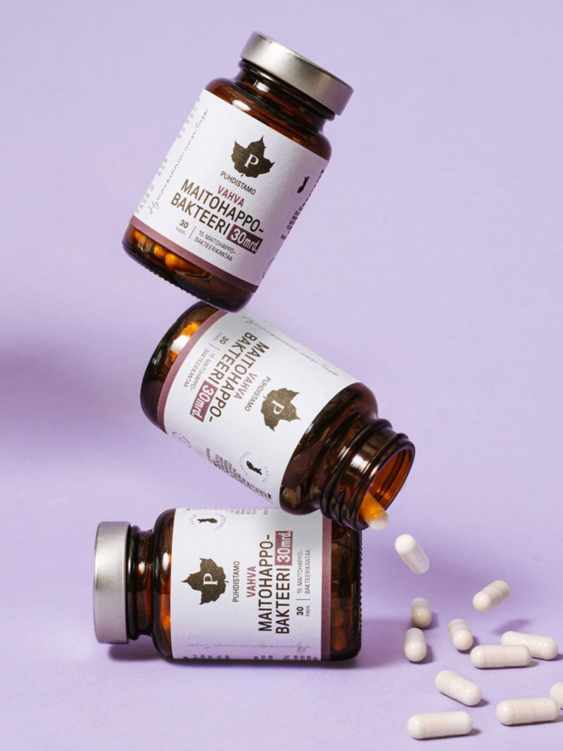 Puhdistamon 3 purkkia Vahvaa 30 mrd. Maitohappobakteeria lilaa taustaa vasten